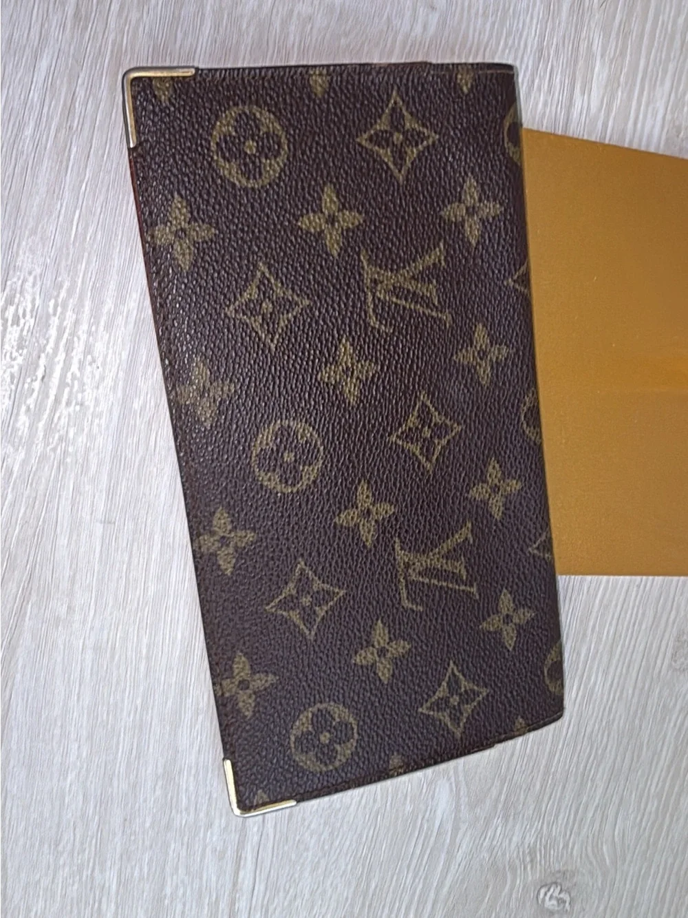 1984 Louis Vuitton authenticated long checkbook wallet